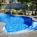 Shot of residential backyard swimming pool and hot tub